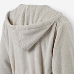 Close-up of the back hood detail on a light taupe terry cotton bathrobe.