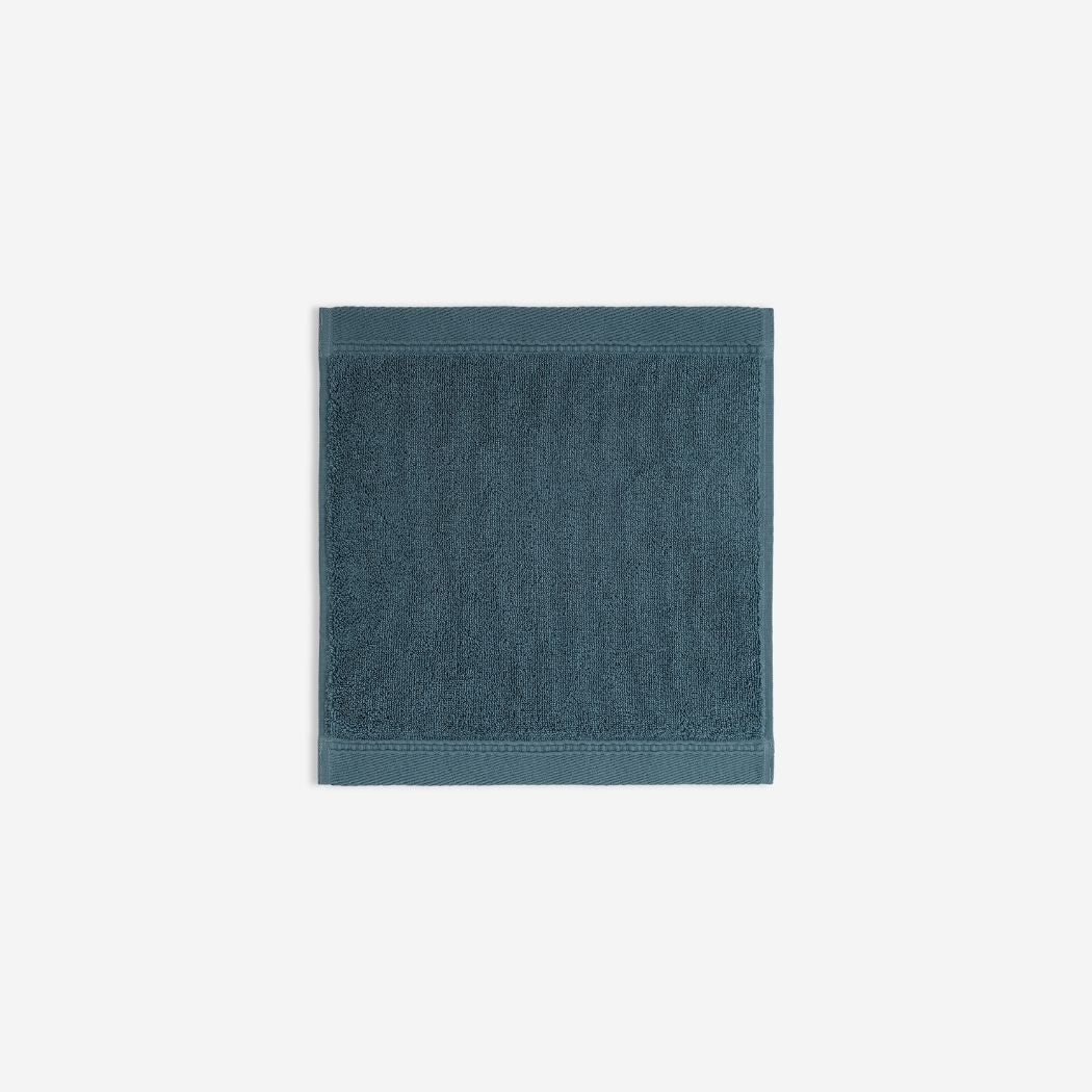 Dark blue organic cotton washcloth.
