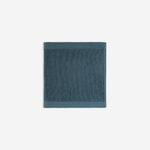 Dark blue organic cotton washcloth.