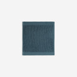 Dark blue organic cotton washcloth.