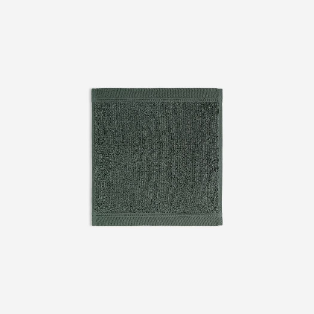 Dark green organic cotton washcloth.