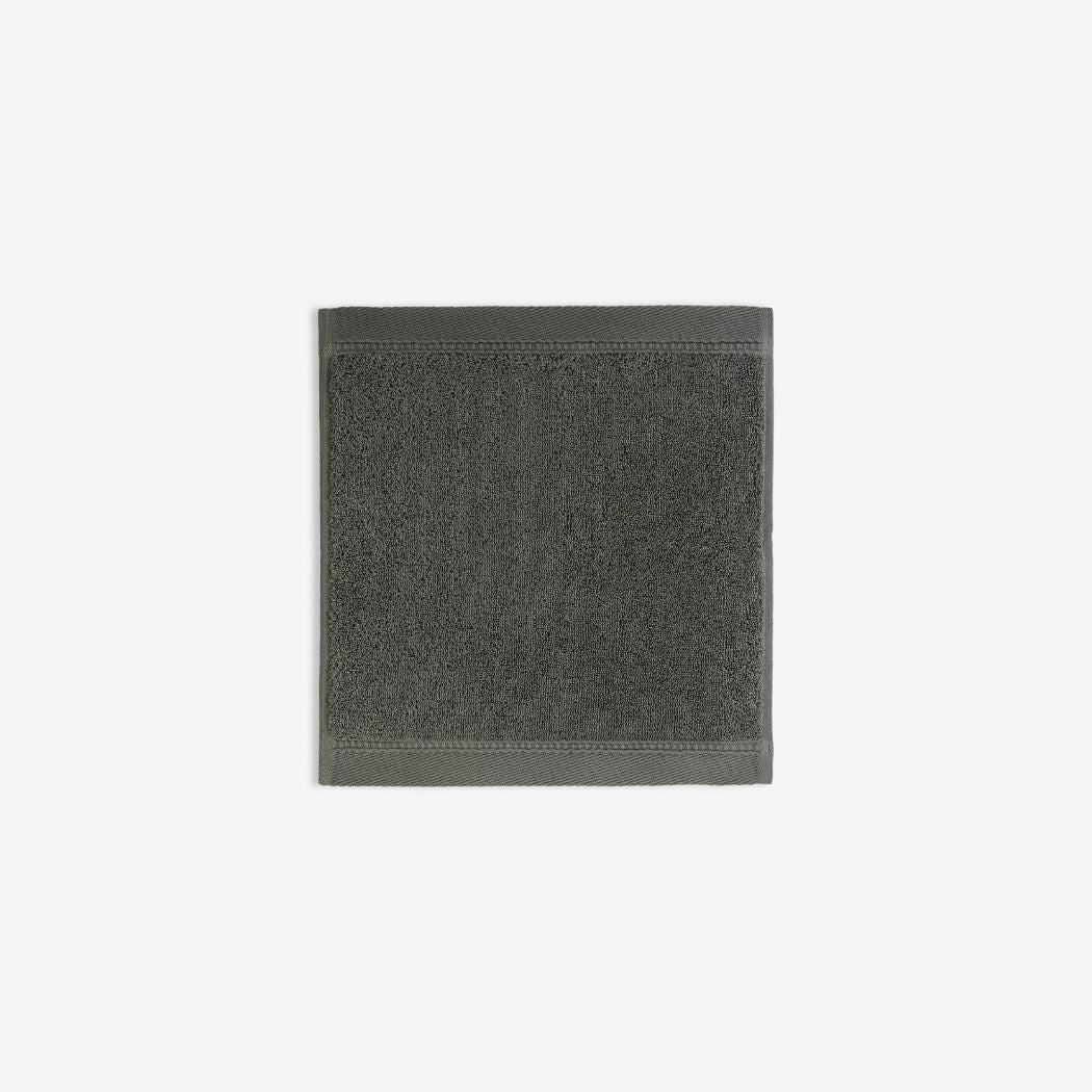 Dark grey organic cotton washcloth.