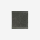 Dark grey organic cotton washcloth.