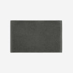 Charcoal gray cotton bath sheet in horizontal orientation with woven border bands, shown against a white background.