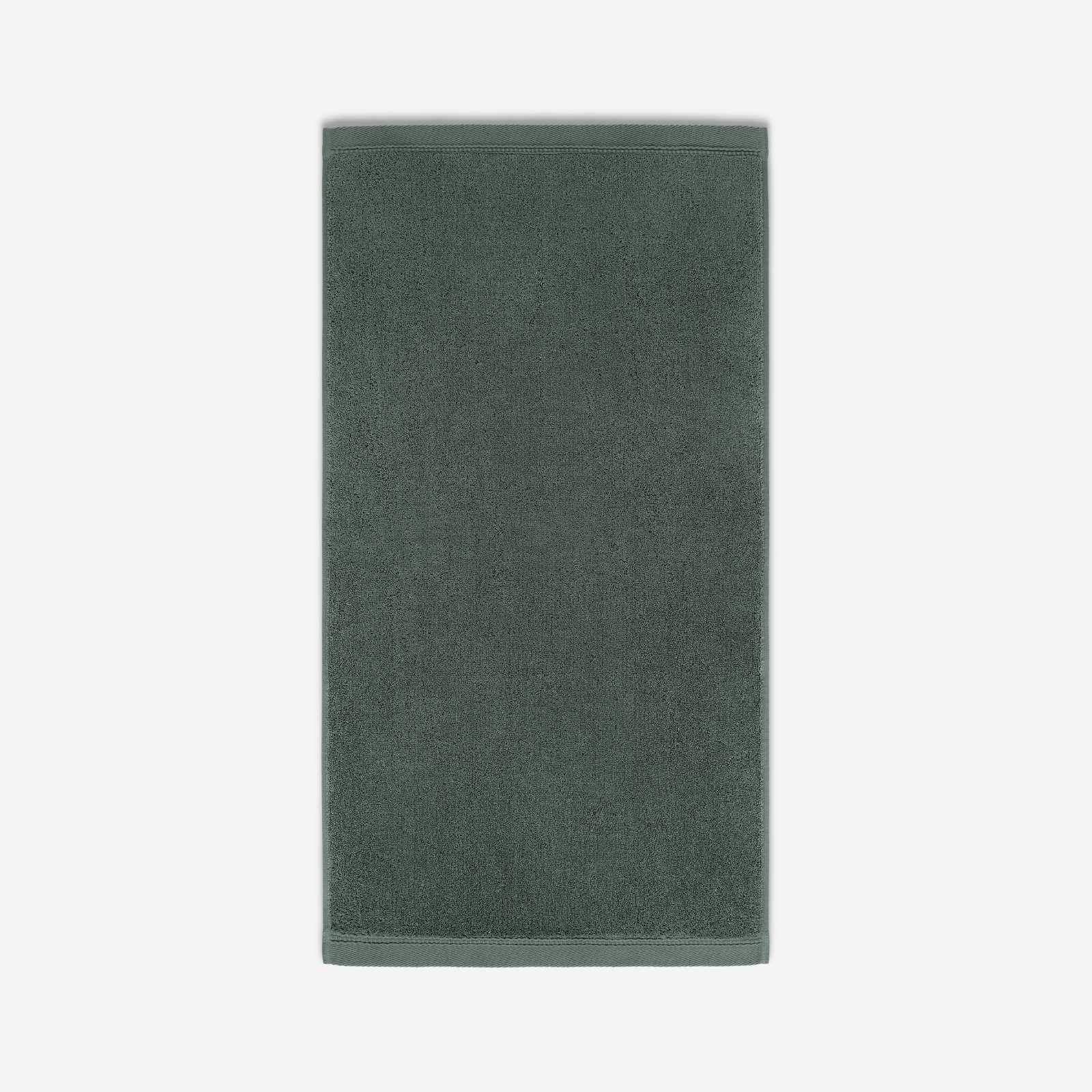 Deep forest green cotton bath sheet in vertical orientation with woven border bands, shown against a white background.