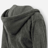 Close-up of a dark grey terry cotton bathrobe showing the hood detail and plush texture.