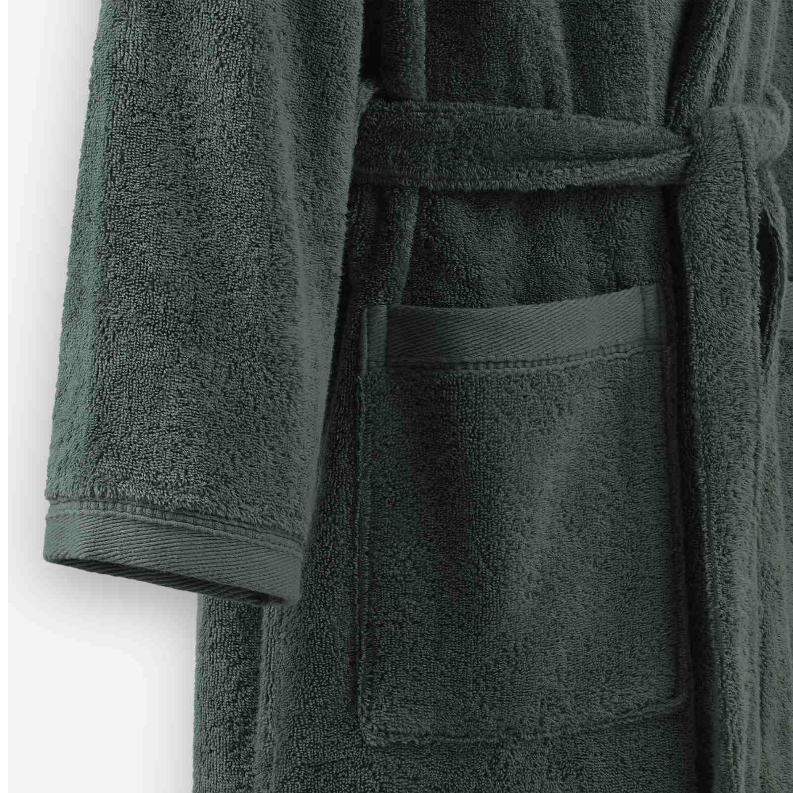 Close-up of a mosstone terry cotton bathrobe showing the waist tie belt, front patch pocket, and sleeve cuff detail.