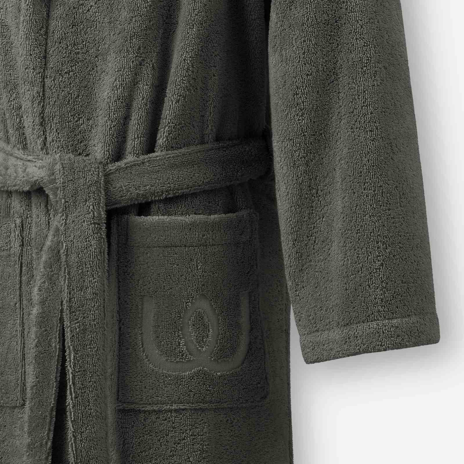 Close-up of a charcoal gray terry cotton bathrobe showing the belt and front pocket with embroidered logo detail.