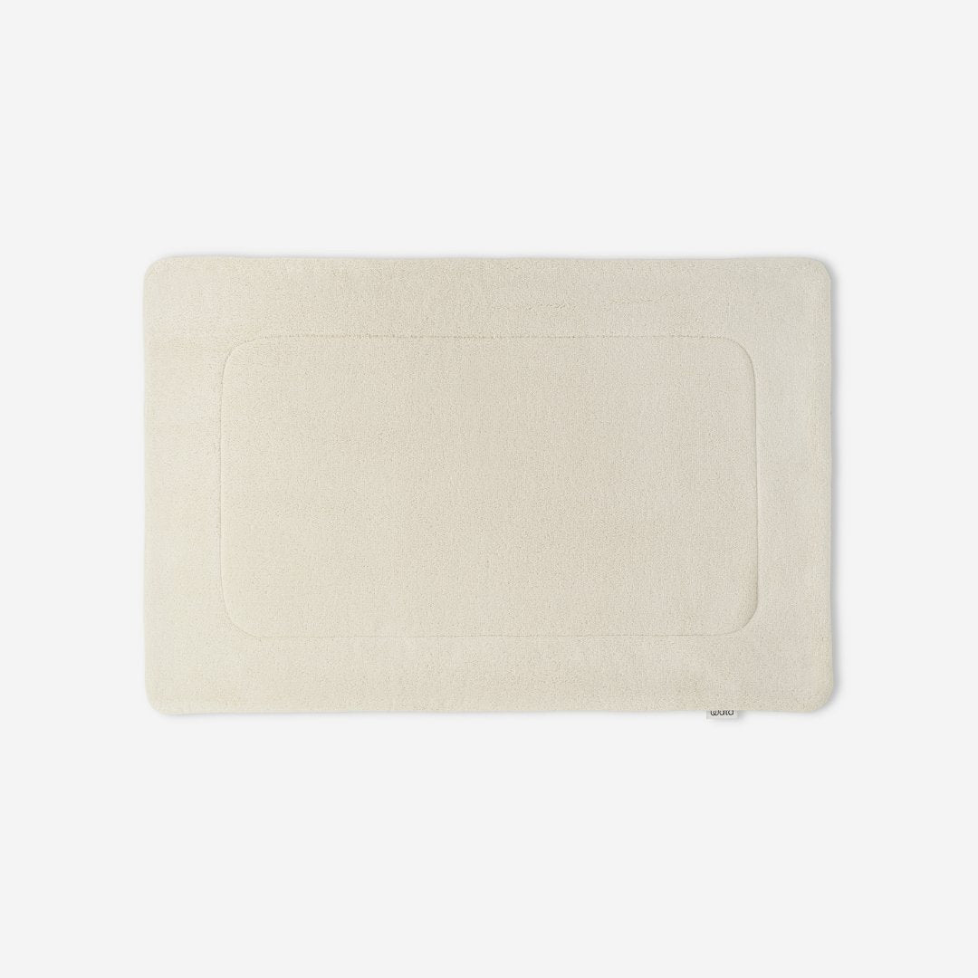 WATA VIVO Organic Cotton bath mat in ivory, 1300 GSM, top view, 60 x 90 cm.