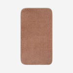 Top view of a dusty rose organic cotton bath sheet with rounded corners, displayed flat on a white background.