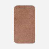 Top view of a dusty rose organic cotton bath sheet with rounded corners, displayed flat on a white background.