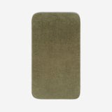 Top view of a dark olive green towel laid flat on a light background, with rounded corners and a small embroidered logo in the lower corner.