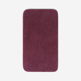 Top view of a purple organic cotton bath sheet with rounded corners, displayed flat on a white background.