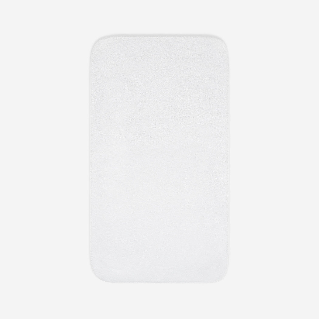 Top view of a white cotton towel laid flat with rounded corners, shown on a white background.