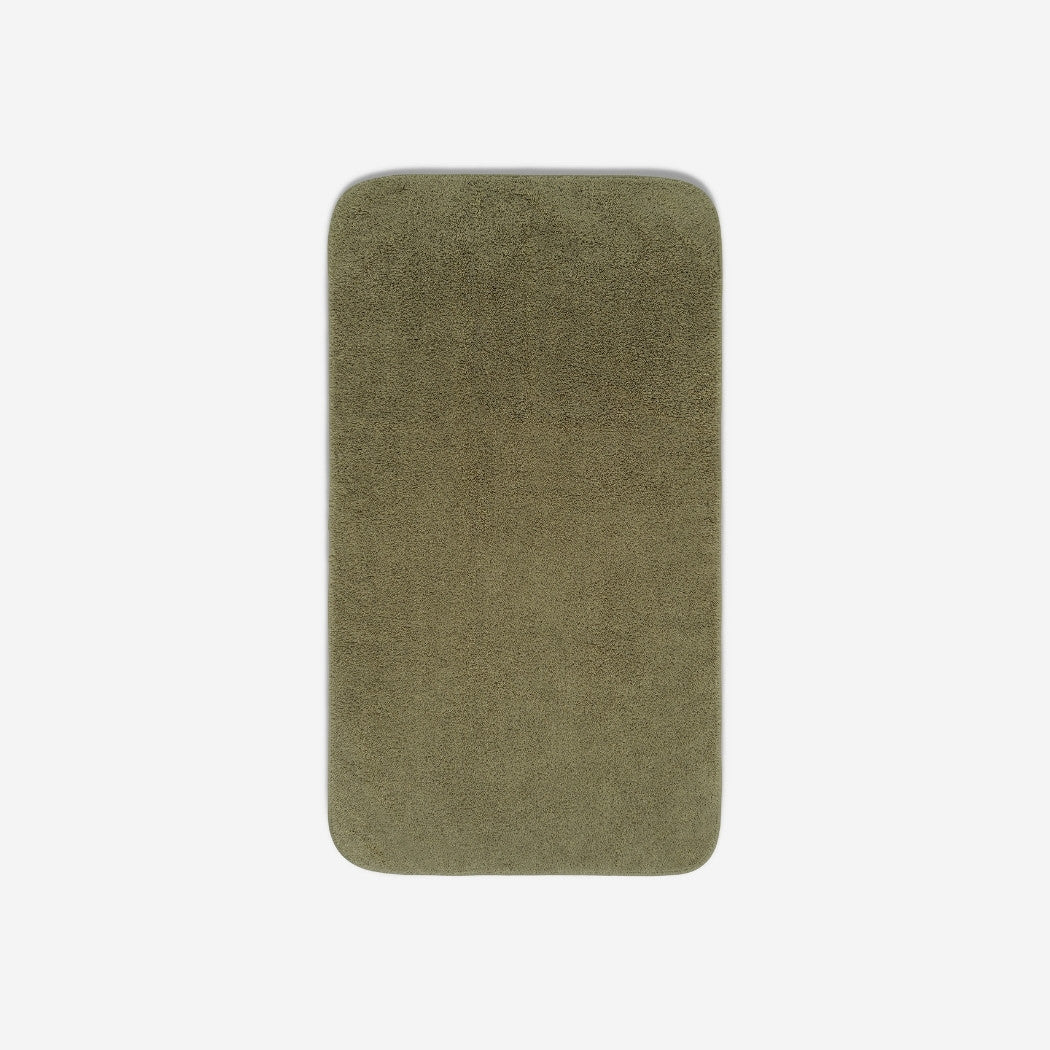 Top view of a dark olive organic cotton towel laid flat with rounded corners, shown on a white background.