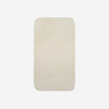 Top view of a light cream cotton bath towel with rounded corners, displayed flat on a white background.