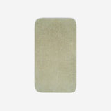 Top view of a light grey organic cotton towel laid flat with rounded corners, shown on a white background.