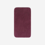 Top view of a purple cotton bath towel with rounded corners, displayed flat on a white background.