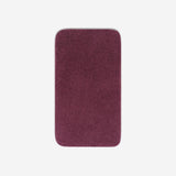 Top view of a purple cotton bath towel with rounded corners, displayed flat on a white background.