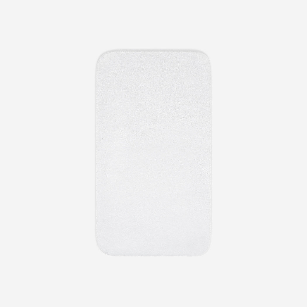 Top view of a white cotton towel laid flat with rounded corners, shown on a white background.