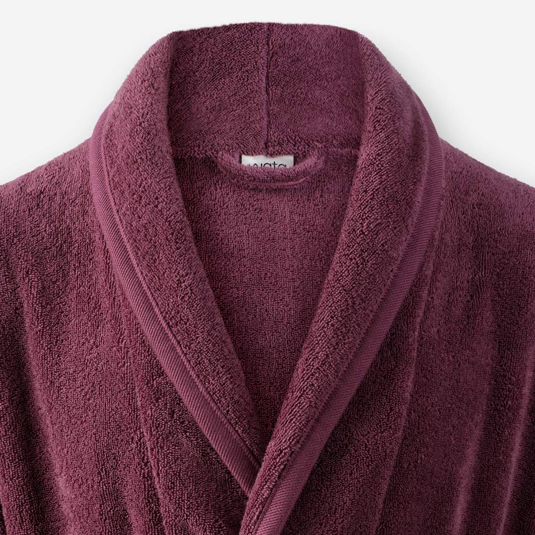 Shawl collar detail of WATA VIVO organic cotton bathrobe in purple.