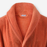 Shawl collar detail of WATA VIVO organic cotton bathrobe in terracotta.